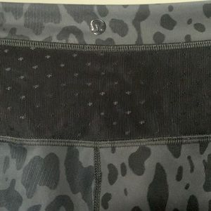 Lululemon leopard print leggings with mesh detail on the side of the legs.